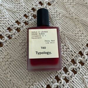 Typology lip oil-ruby red